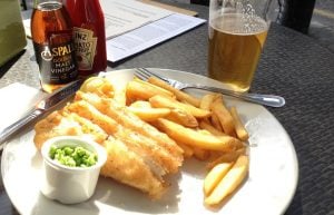 fish, chips and mushy peas on plate