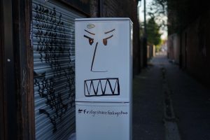 fridge freezer with angry face drawn on