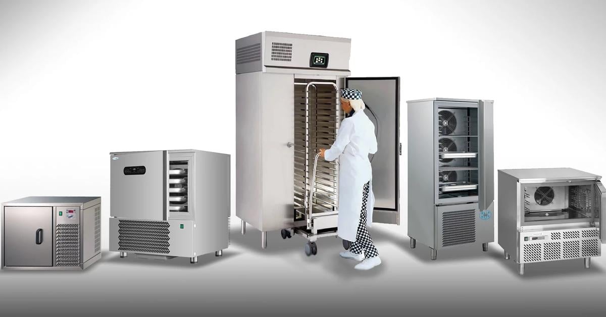 row of different sized blast chillers and freezers with a chef rolling shelves into the largest one
