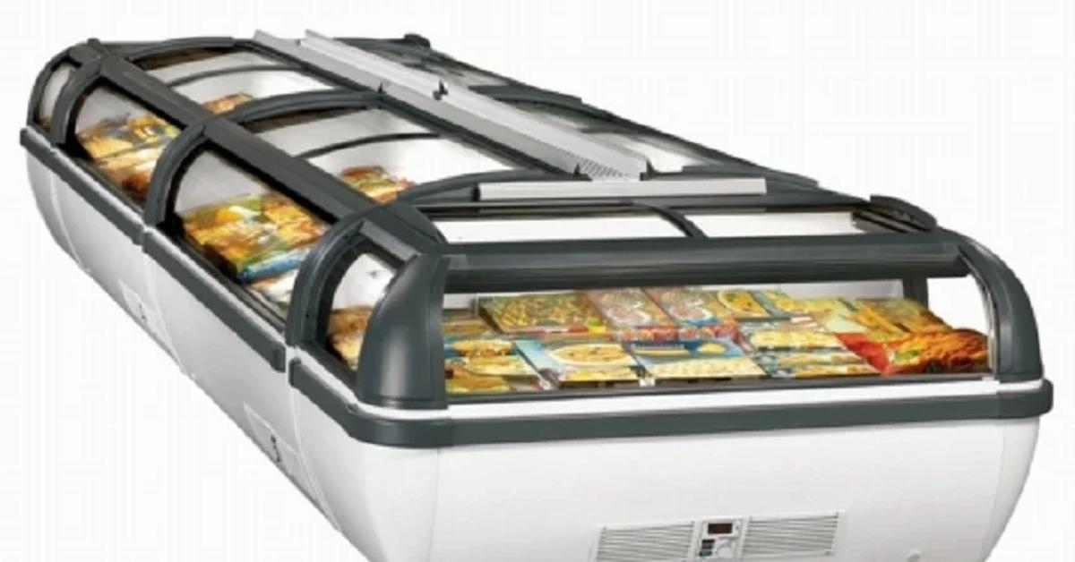 island set-up of display chest freezers filled with food