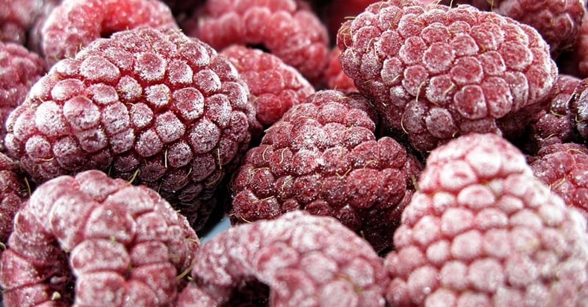 close up image of frozen raspberries