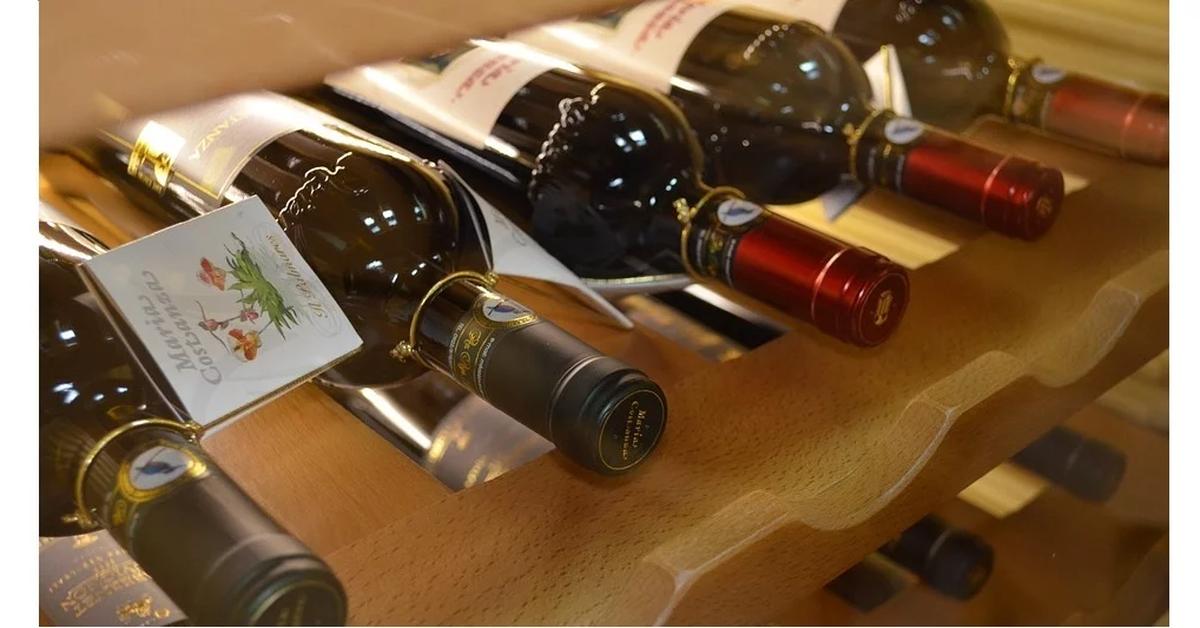 wine bottles in a wooden wine rack